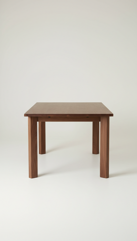 Walnut dining table with tapered legs